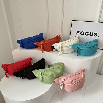 Orange compact crossbody waist bag with adjustable strap and front zipper pockets